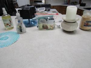 lot 49 image: Hand soap, rain mate oils new, scentsy warmer, vanilla candle rainbow humidifier