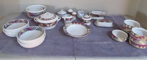 lot 56 image: Studio Nova Palm Desert dishes- 4 salad bowls,1 soup tureen covered, 3 mixing bowls, sugar creamer, S&P, small bowls, gravy boat and covered butter dish