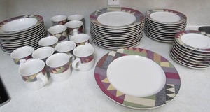 lot 57 image: Studio Nova Palm Desert dishes- 12 cups, 1 serving plate, 8 saucers, 11 salad plates,12 dinner plates 12 soup bowls