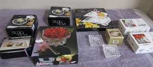 lot 61 image: two NIB 6 egg cup candle holders Keepsake collection ashtray set Studio nova footed dessert set NIB S&P set with stand butter dish NIB x 2