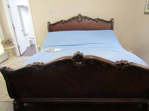 lot 8 image: King  Solid Wood Sleigh Bed  Headboard, Footboard  & Side rails  very nice and heavy with Temper Pedic electric bed  2 remotes