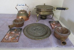 lot 71 image: 2 small brown stoneware pots Bronze tea kettle 11 brass wall plate heat wave cooker
