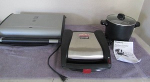 lot 74 image: Presto Kitchen kettle multi cooker steamer Johnsonville sausage cooker  Lean mean grilling machine