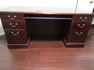 lot 29 image: VERY nice cherry wood desk w marble inset. Keyboard pullout 1 side door 3 drawers 30x71x35