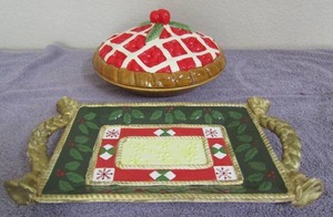 lot 95 image: Covered cherry pie plate 14x8 Studio Nova Holly Santa platter