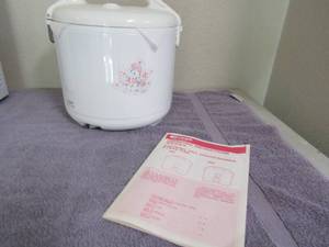 lot 93 image: Tiger rice cooker with instruction and cook book