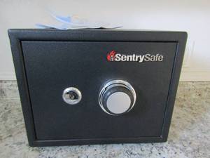 lot 94 image: Sentry safe with keys and combo reset instructions