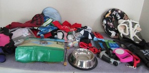 lot 97 image: Doggy lot- clothes, jackets, hats, bowls, leashes, cooling mat and more