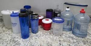 lot 103 image: Lot- storage containers, cups and water jugs