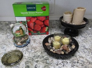 lot 112 image: Garden line upside down planter NIB, ash trays, rock candle garden x 2 light house snow globe