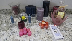 lot 114 image: Candle lot all sizes, 2 candle sticks and deck delights new
