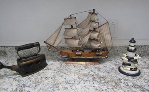 lot 117 image: Vintage iron, light house napkin ring holder 14x18 hurricane wooden sail boat