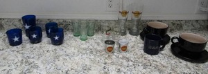 lot 123 image: 5 plastic Dallas cowboy cups, 3 glass coke cups, 2 peanut pails 2 black soup cups and saucers