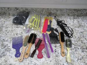 lot 129 image: Lot of new and used- Brushes comps, perm rods, curling irons