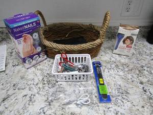 lot 134 image: Wicker basket personal items- Nettie pot and salts, tweezers, hair dryer. Clippers etc.