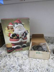 lot 151 image: Santa Cookie jar NIB silver bell metal tin.