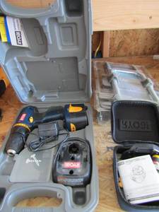 lot 189 image: Ryobi drill in case with battery and charger,  also air grip laser level,  Luggage carrier NIB