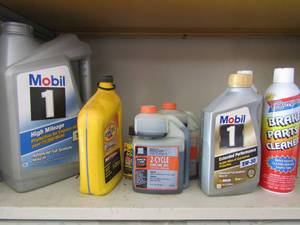 lot 199 image: Lot of opened  Mobil oil for car send 2 cycle oil plus brake cleaner