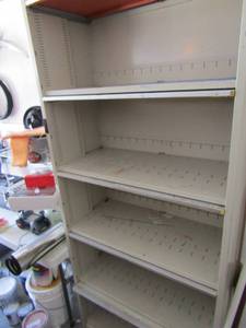 lot 201 image: Metal  5 shelf front pull down door for storage space in garage 83x36x17