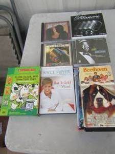 lot 237 image: Music CDs- country, classic groove, VHS Christmas movies and Battlefield of Mind DVD