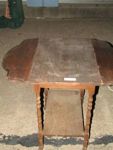 lot 254 image: Antique rolling drop leaf carttable with fold down sides and oversized original castor wheels 28x34x25 with sides up