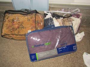 lot 256 image: Queen size bed spread and plastic bag full of curtains and additional spread