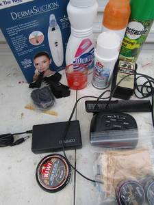 lot 269 image: Kiwi shoe polish Derma suction, woolite, shoe cleaner candle and alarm clock