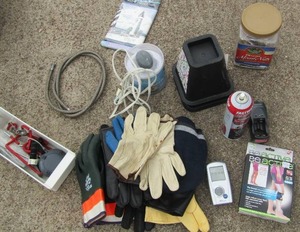 lot 275 image: Gardening gloves, knee pads, furniture lifters x2 radio shack battery charger