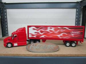 lot 9 image: PETERBILT 18 WHEELER LARGE MODEL, TRAILER DETACHES AND OPENS, MEASUREMENTS IN PICS, VINTAGE METAL PETERBILT EMBLEM,