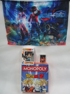 lot 11 image: DRAGONBALL Z MONOPOLY W ALL PIECES, GOKU PHUNKO POP FIGURE, DRAGONBALL Z PLAYING CARDS & JUMPFORCE BANNER
