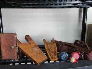 lot 16 image: VINTAGE LOT 2 VINTAGE BOOT PULLERS, LEATHER BELT, WRITING BOOK WITH BUFFALO NICKLE AS BUTTON, 2 YO-YOS & TOP