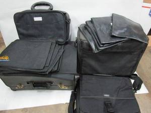 lot 19 image: TARGUS LAPTOP BAG, MANY WRITER KEYBOARD INSTRUCTOR BAGS, 5 LEATHER BANK DEPOSIT BAGS, ROLLING AVER MEDIA BAG & PROJECTOR CASE