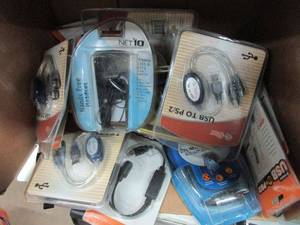 lot 23 image: BOX OF HANDS FREE HEADSETS, USB TO PSP CORDS, EARBUD STEREO PC HEADSETS, ALL IN ORIGINAL PACKAGING