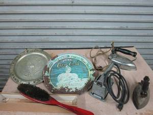 lot 38 image: 2 ANTIQUE IRONS, VINTAGE SANDER, BRUSH, 75TH ANNIVERSARY COCA COLA PLATE, MADE IN MEXICO DECORATIVE AZTEC CALENDAR PLATE