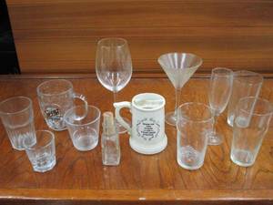 lot 70 image: VARIETY OF DRINKING GLASSES, CHAMPAGNE FLUTE, MARITINI, HIGH BALL, MUSTACHE PROTECTING MUG, ETC.