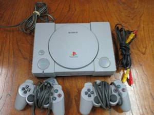 lot 101 image: SONY ORIGINAL PLAYSTATION & 2 CONTROLLERS, ALL IN AMAZING CONDITION, TURNS ON