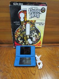 lot 84 image: NINTENDO DS XL W CHARGER, NO GAME SO DID NOT TEST, PS3 & XBOX MOTLEY CREW GUITAR HERO FACEPLATE