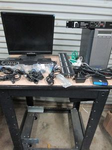 lot 98 image: I-INC MONITOR, MCAFEE FAIL OPEN MODULE, 1000 BASE-T, KVM CONVERSION CABLES, TRENDNET TC-P4SC5E, ULTRATRAK 100 TX4, RCC ETHERNET TRANSCEIVER, DELL POWER C CONNECT, CORDS AND ROLLING STAND INCL.