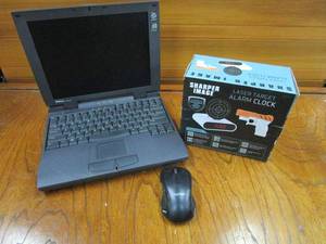 lot 100 image: DELL LATITUDE LAPTOP, UNTESTED-NO CHARGER, LASER TARGET ALARM CLOCK, UNUSED, IN ORIGINAL BOX