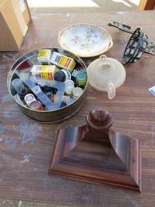lot 26 image: Can full of used speedball and pelican paint, book ends, metal wall hanger and rose wall pate