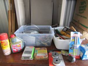 lot 17 image: Garage lot-chainsaw chains, weedeater, line feed spools, epoxy, 2 cycle oil and more