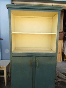 lot 50 image: Green shelf 2 tier top storage dbl doors at bottom with 3 shelves 67x11x13