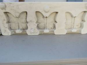 lot 78 image: Clay molds pig napkin holders x 4 and butterfly beads