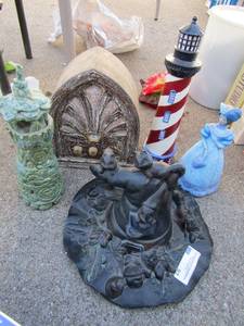 lot 91 image: Ceramic lot- lady, 13 lighthouse, witches hat with cat and more