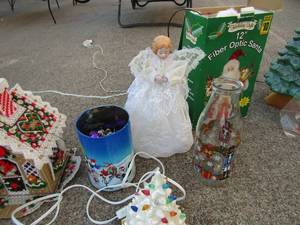 lot 98 image: 12 fiber optic santa  10 lighted angel, christmas milk jug     8 lighted tree,