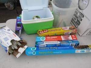 lot 109 image: Mini Rubbermaid cooler, plastic forks  opened foil and plastic wrap