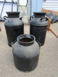 lot 123 image: Heavy duty dairy milk jugs black double handle 24 tall,   1 black handle heavy jug metal 15 tall