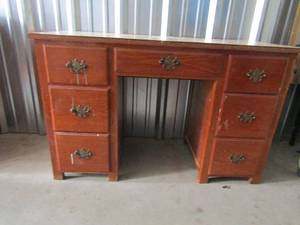 lot 132 image: 7 drawer brown desk with linoleum top 31x48x20
