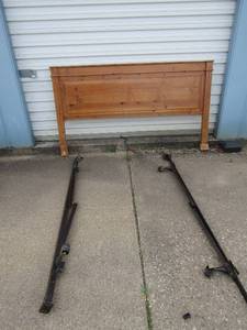 lot 152 image: Solid wood queen size Head board with metal side rails