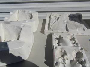 lot 189 image: molds- Lion planter, dinosaur, christmas cat and dog